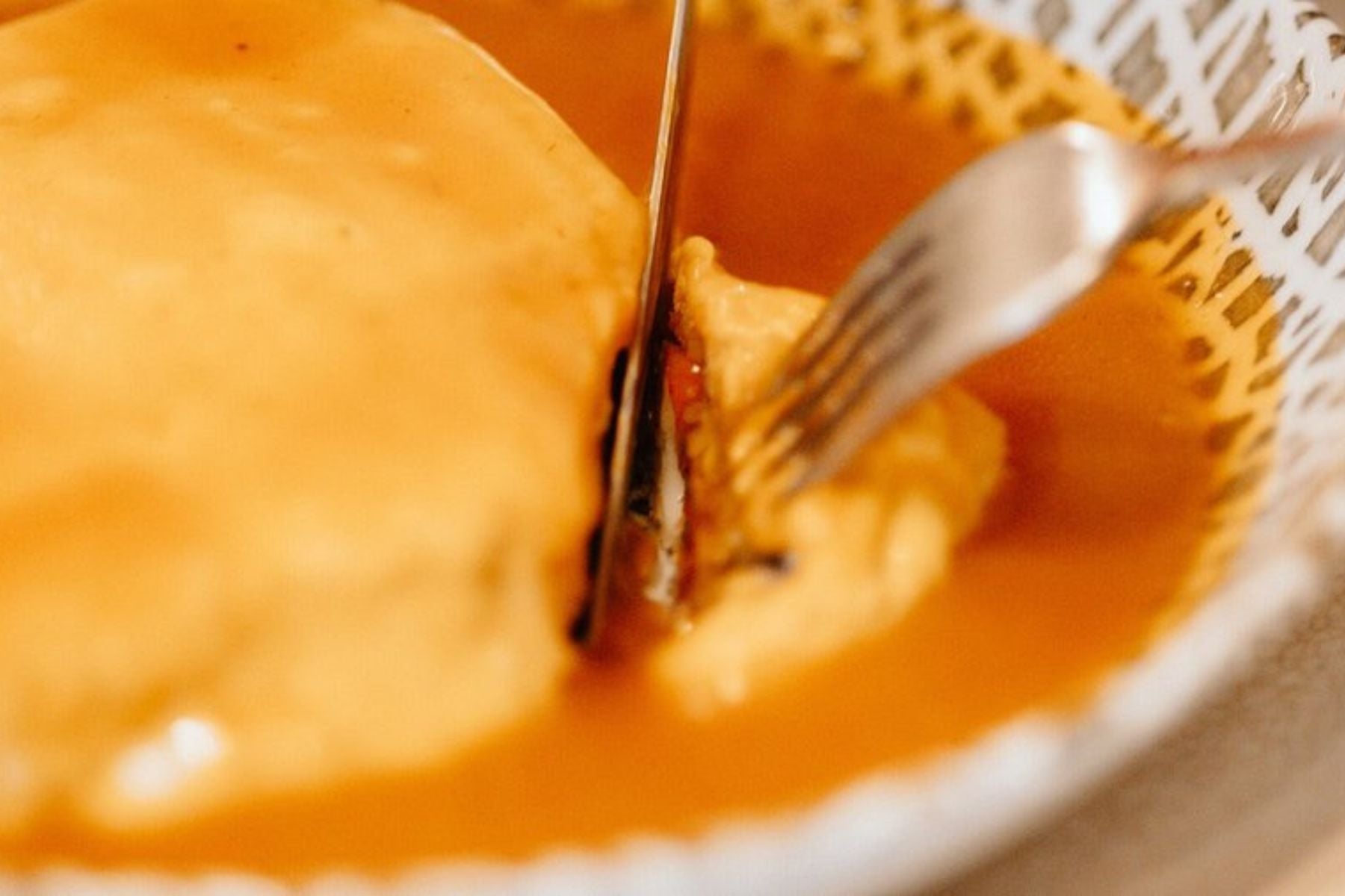 Traditional Francesinha served with its signature sauce in Porto, Northern Portugal