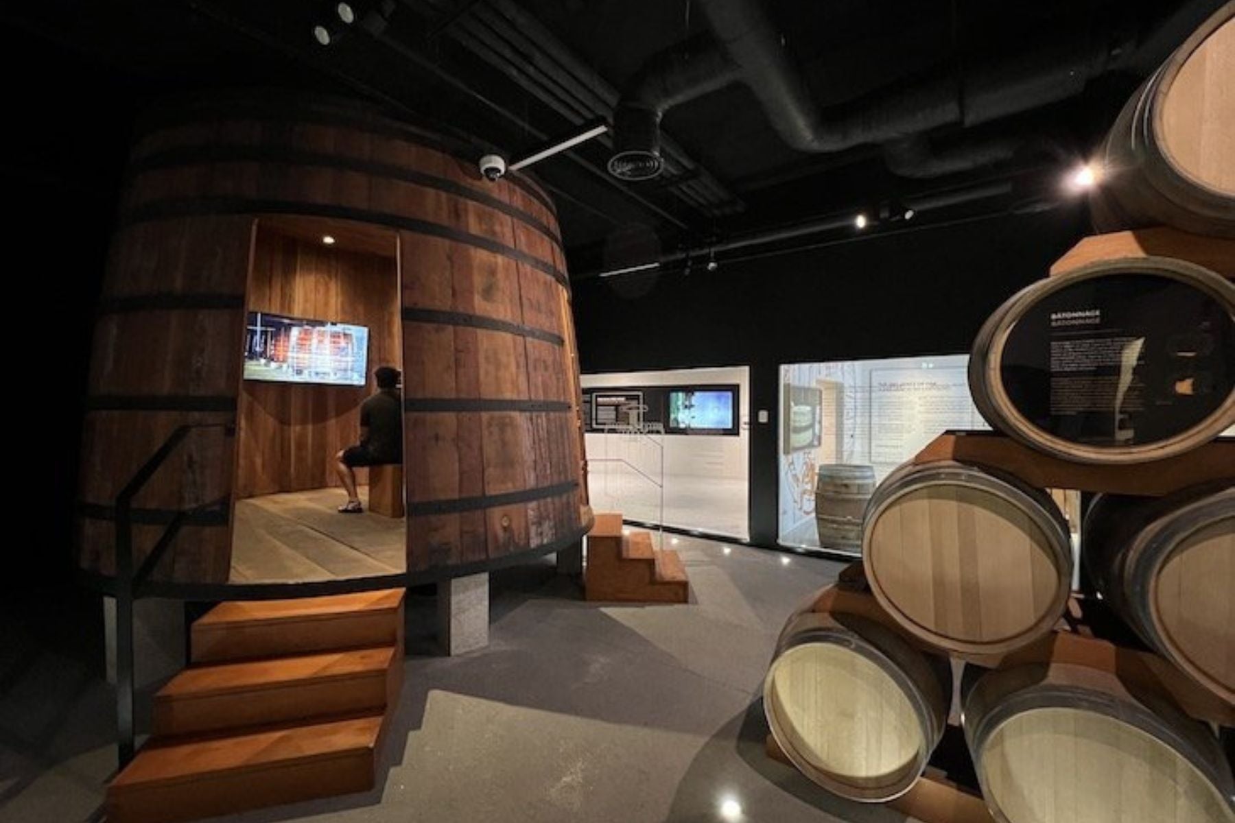 Wine exhibition space with oak barrels at WOW – World of Wine in Porto